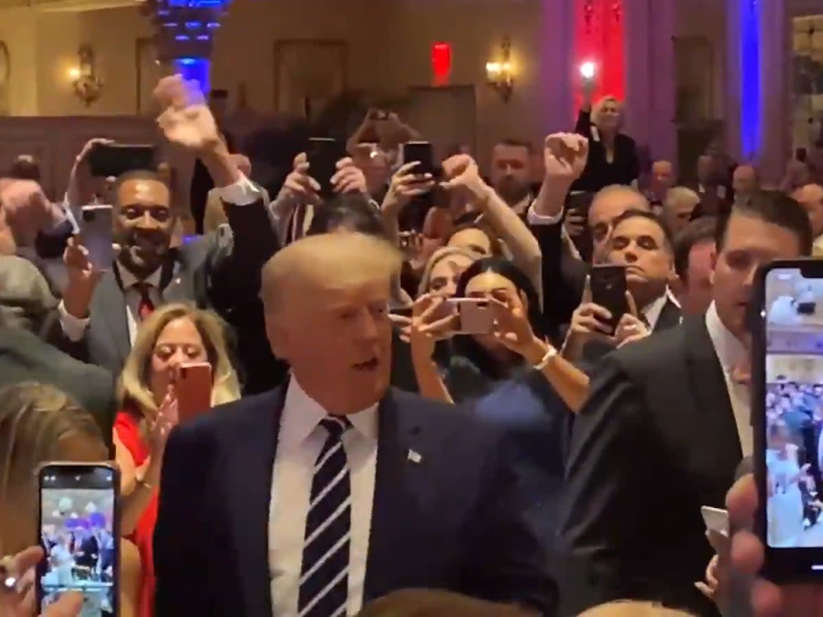 <p>Florida representative Anthony Sabatini tweeted footage from an apparent fundraising dinner on Saturday showing a large crowd waving at the former president and taking photos</p> (Twitter/ Anthony Sabatini )