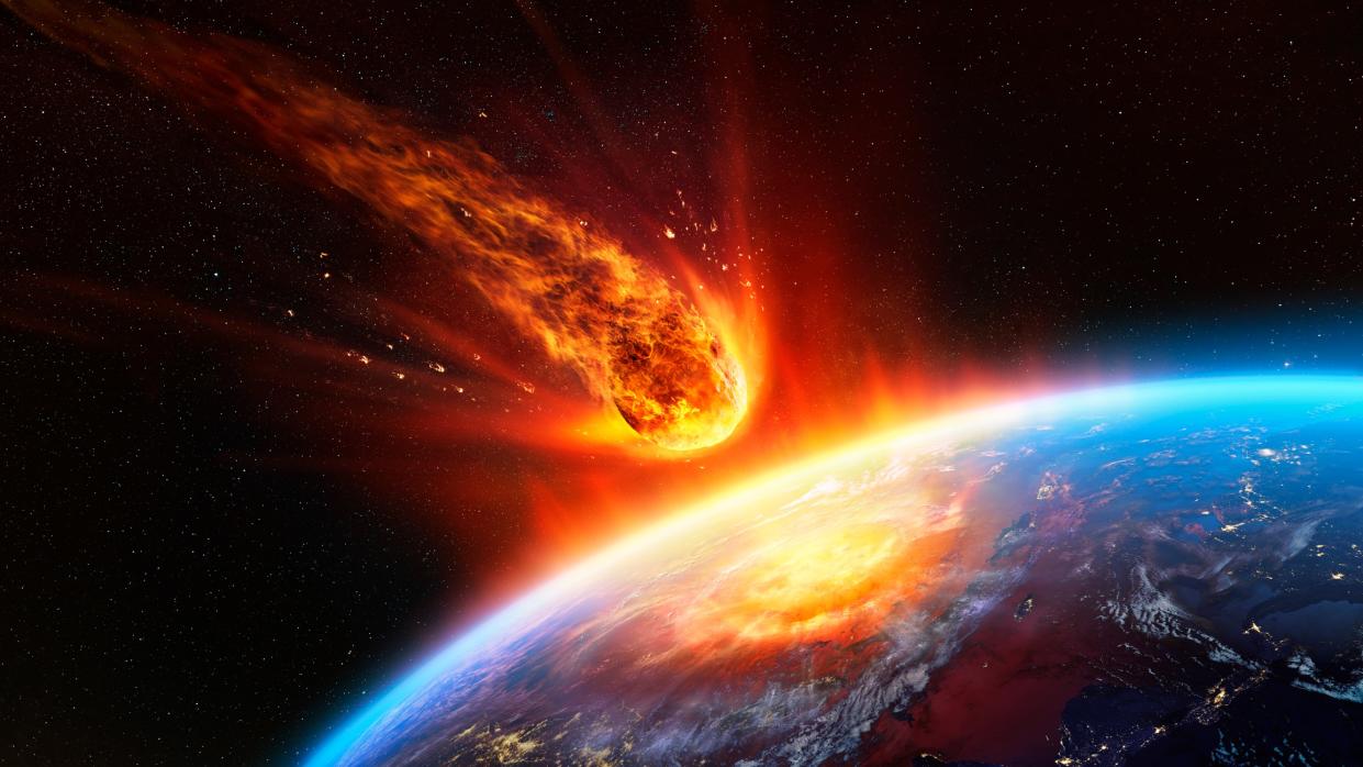  We see an enormous, fiery asteroid falling through Earth's atmosphere and very nearly hitting our blue planet. 