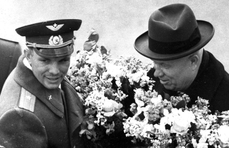 FILE - In this Friday, April 14, 1961 file photo, Soviet leader Nikita Khrushchev, right, greets cosmonaut Major Yuri Gagarin at the Vnukovo airport in Moscow. Soviet cosmonaut Yuri Gagarin became the first human in space 60 years ago. The successful one-orbit flight on April 12, 1961 made the 27-year-old Gagarin a national hero and cemented Soviet supremacy in space until the United States put a man on the moon more than eight years later. (TASS News Agency via AP, File) JAPAN OUT