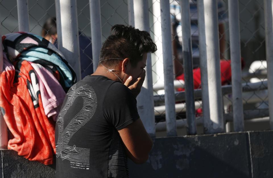 Brando Gonzalez Ortiz cries after receiving the news of his mother Carmen Ortiz's death of COVID-19 outside Iztapalapa General Hospital in Mexico City on May 3, 2020.