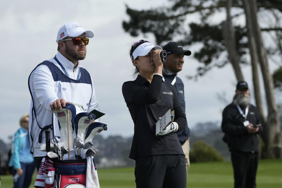 Danielle Kang, second from left, of the United States, looks toward the 12th green at the International Crown match play golf tournament in San Francisco, Thursday, May 4, 2023. (AP Photo/Jeff Chiu)