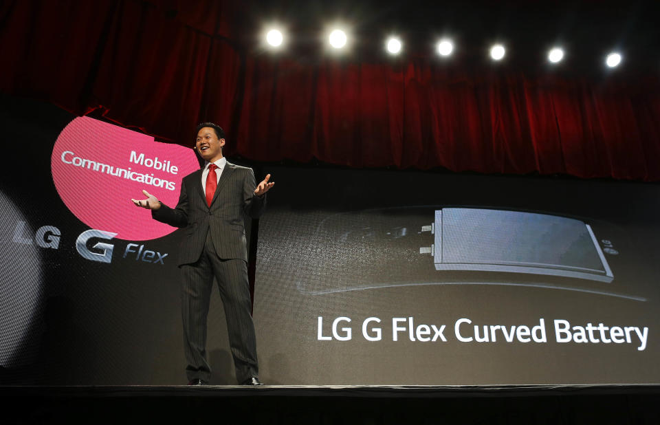 LG spokesman Frank Lee talks about the LG G Flex curved smartphone battery during the 2014 Consumer Electronics Show, Monday, Jan. 6, 2014, in Las Vegas. The phone, already available in some foreign markets, will debut in the United States in the Spring. (AP Photo/Julie Jacobson)