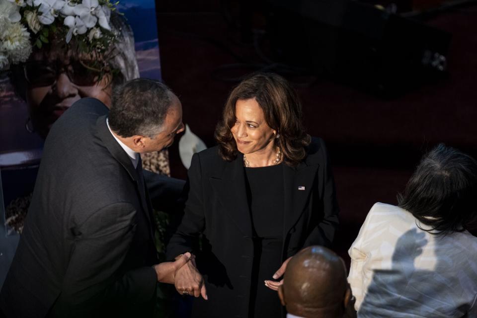 Kamala Harris smiles at her husband, Doug Emhoff