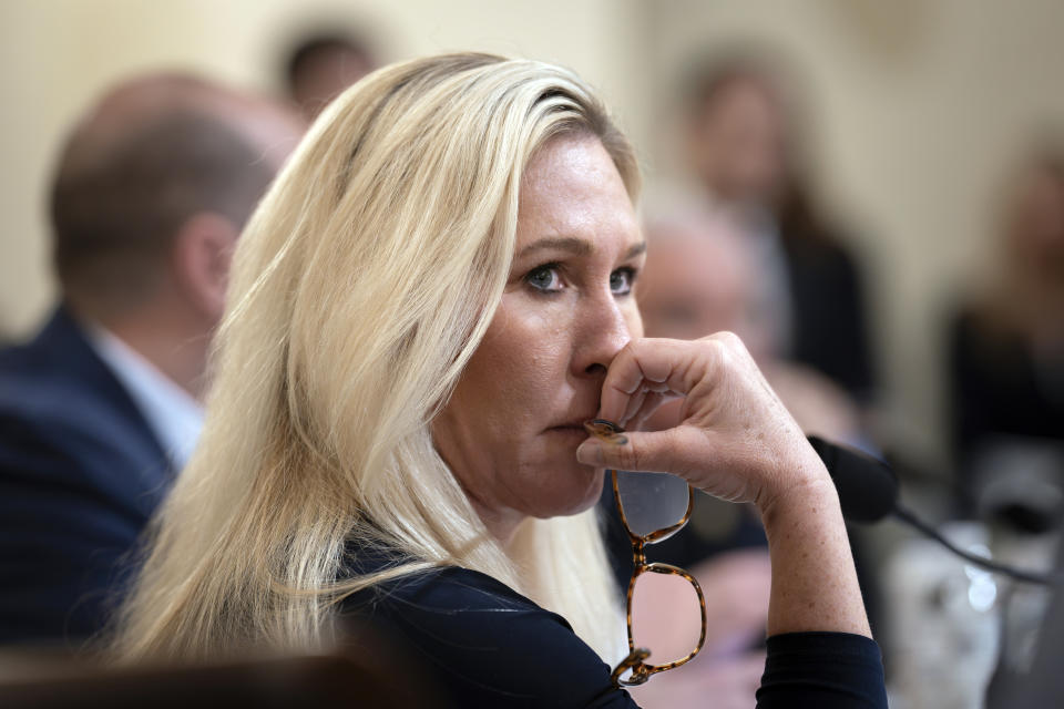 FILE - Rep. Marjorie Taylor Greene, R-Ga., listens during a House Homeland Security Committee hearing, at the Capitol in Washington, Jan. 30, 2024. The Supreme Court on Tuesday rejected appeals from three Republican U.S. House members who challenged fines for not wearing face coverings on the House floor in 2021. The justices did not comment in leaving in place $500 fines issued in May 2021 to U.S. Reps. Marjorie Taylor Greene of Georgia, Thomas Massie of Kentucky and Ralph Norman of South Carolina. (AP Photo/J. Scott Applewhite, File)