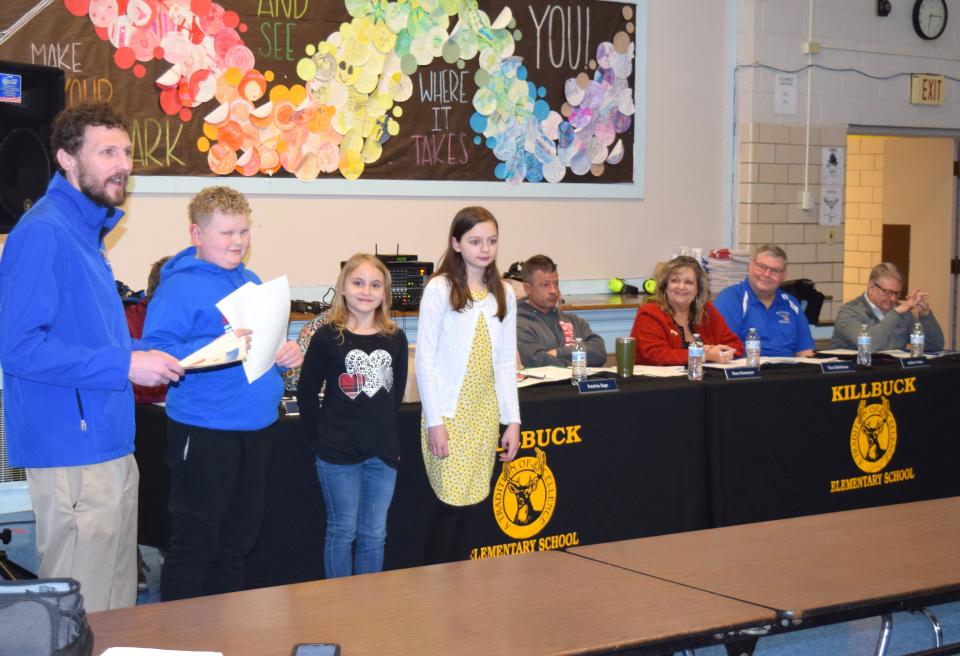 Killbuck Elementary School Principal Brian Lash commended fifth-graders Haden Lint, Cambree Garver and Ellie Schafer for their recent success in the Tom Graham 5th Grade Farm Tour and Holmes County Spelling Bee contests.