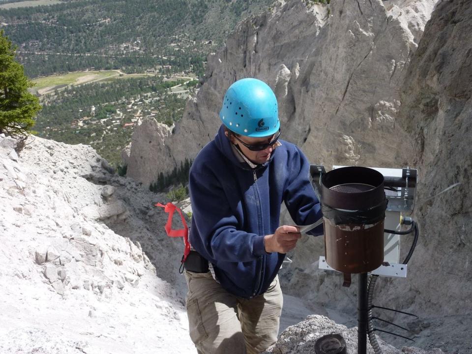 Jason Kean, a research hydrologist with the U.S. Geological Survey, conducts research at Chalk Cliffs in Colorado, in 2010.