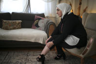 Fatima Alzahra Shon, 32, a Syrian refugee, shows the wound on her leg to The Associated Press during an interview in Istanbul, Friday, Sept. 17, 2021. (AP Photo/Emrah Gurel)