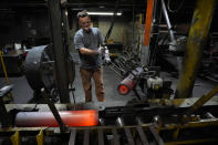 A steel worker moves heated 155 mm M795 artillery projectiles during the manufacturing process at the Scranton Army Ammunition Plant, Tuesday, Aug. 27, 2024, in Scranton, Pa. (AP Photo/Matt Slocum)