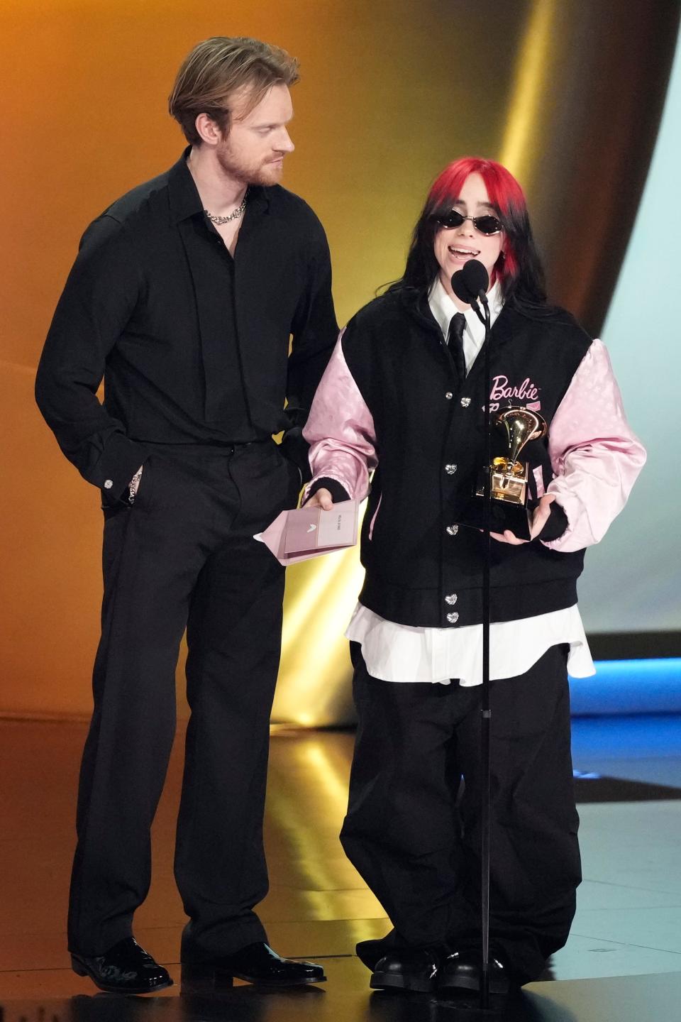 Billie Eilish, right, and FINNEAS accept the award for song of the year during the 66th Annual Grammy Awards.