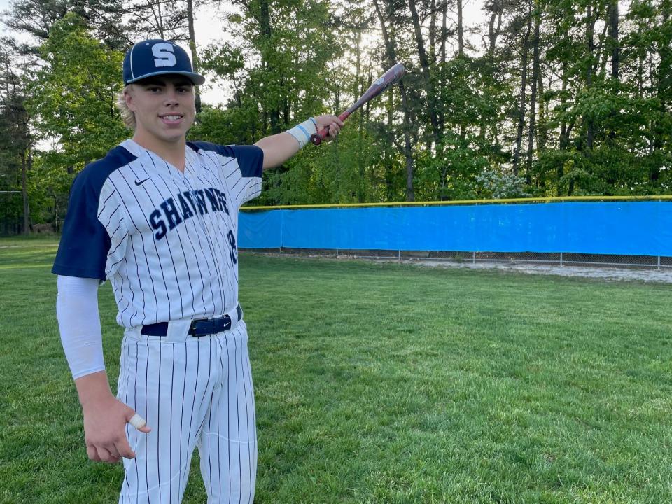 Shawnee junior Oskar Heino points to where he hit a walk-off, three-run homer as his team defeated Lenape 7-4 on Tuesday to clinch a share of the Olympic Conference American Division championship.