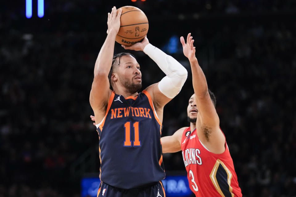 New York Knicks guard Jalen Brunson (11) shoots a 3-point basket past New Orleans Pelicans guard CJ McCollum (3) during the first half of an NBA basketball game, Saturday, Feb. 25, 2023, at Madison Square Garden in New York. (AP Photo/Mary Altaffer)