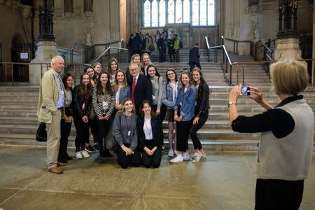 Britain's opposition Labour Party leader Jeremy Corbyn poses for a photograph with pupils from Guildford High School in Westminster Hall in the Houses of Parliament in London, Britain, June 28, 2017. REUTERS/Jack Taylor/Pool