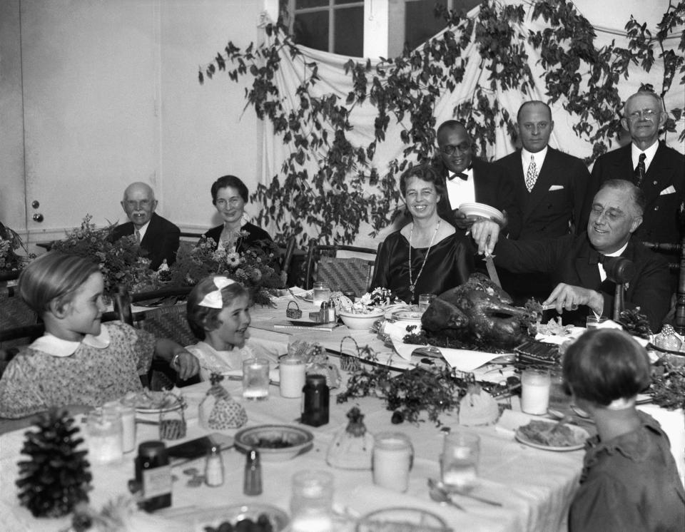 President Franklin D. Roosevelt carves the turkey during the annual Thanksgiving dinner in 1933 for polio patients at Warm Springs, Georgia, with first lady Eleanor Roosevelt smiling beside him. Roosevelt was among the most famous Americans to get polio, and he helped start what eventually would become the March of Dimes. That organization raised money for a vaccine, which was found in 1955 by Jonas Salk.