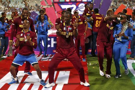 Cricket - England v West Indies - World Twenty20 cricket tournament final - Kolkata, India - 03/04/2016. West Indies players celebrate with the trophy after winning the final. REUTERS/Adnan Abidi