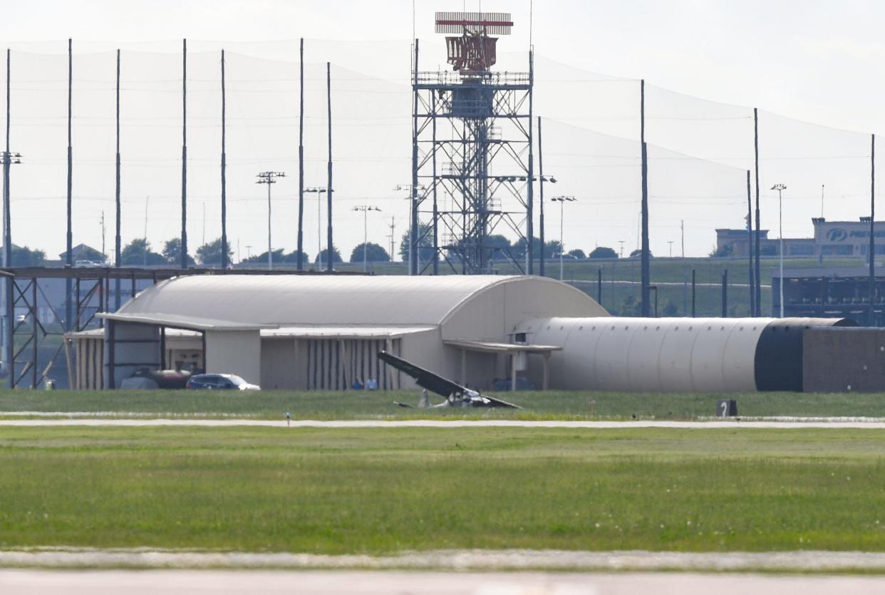 A single-engine aircraft sits at an angle after crashing on Friday, June 10, 2022, at the Sioux Falls airport.
