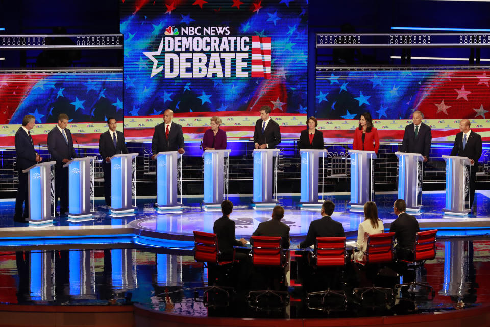 Democratic presidential candidate former Housing and Urban Development Secretary Julian Castro, third from left, answers a question, during a Democratic primary debate hosted by NBC News at the Adrienne Arsht Center for the Performing Art, Thursday, June 27, 2019, in Miami. (AP Photo/Wilfredo Lee)