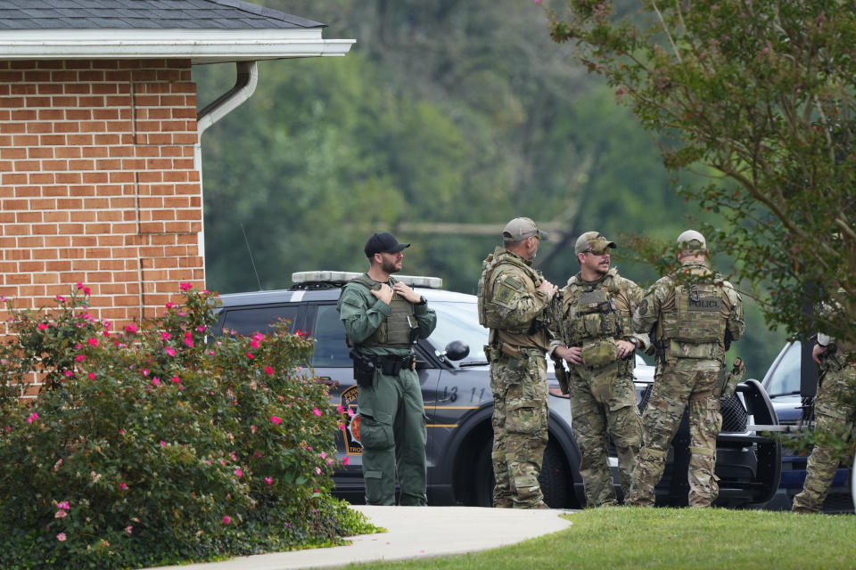 Law enforcement agents stand outside a Pennsylvania State Police barracks at Avondale Pa., where Danelo Cavalcante is being held on Wednesday, Sept. 13, 2023. Cavalcante was captured Wednesday after eluding hundreds of searchers for two weeks. (AP Photo/Matt Rourke)