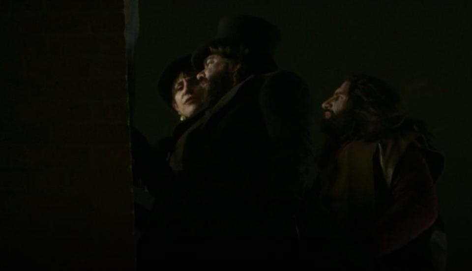Nadja, Laszlo, and Nandor floating and looking into a window in "What We Do in the Shadows"