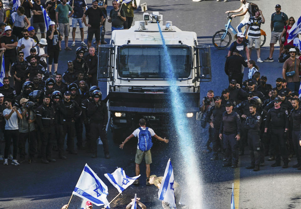 Police use a water cannon a protest against the Netanyahu government's proposed judicial overhaul.