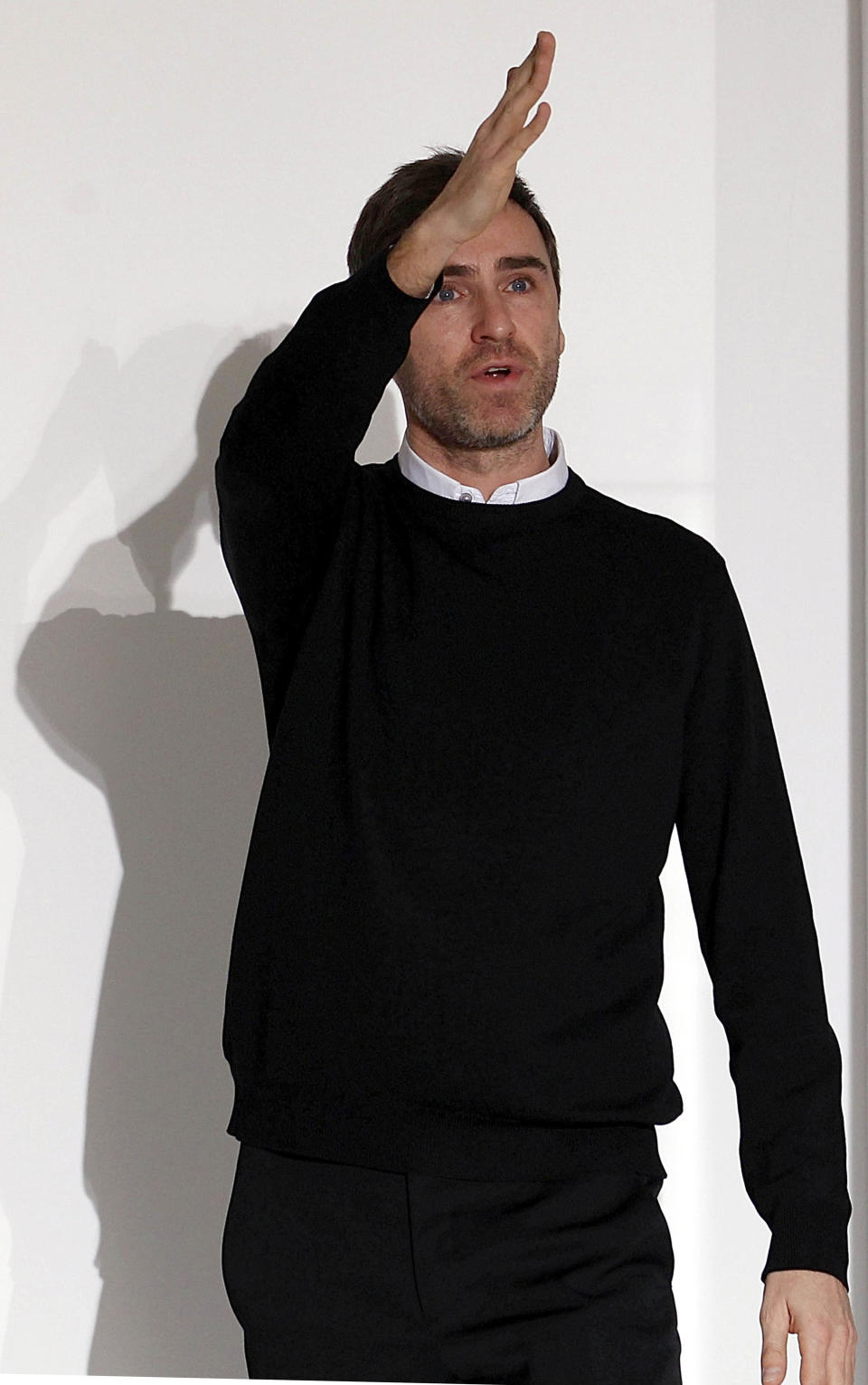 FILE - Belgian designer Raf Simons acknowledges the applause of the audience at the end of the Jil Sander Spring/Summer 2012 women's collection in Milan, in this Saturday, Sept. 25, 2011 file photo. Christian Dior on Monday April 9 2012 named Belgian designer Simons as its new artistic director, and says he'll present his first show for the renowned fashion house in Paris in July. The appointment comes seven months after star designer John Galliano was convicted by a Paris court for making anti-Semitic insults. (AP Photo/Giuseppe Aresu, file)