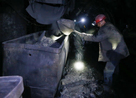 A miner loads a cart inside the Novovolynska-9 coal mine in Novovolynsk, Ukraine August 2, 2018. Picture taken August 2, 2018. REUTERS/Valentyn Ogirenko