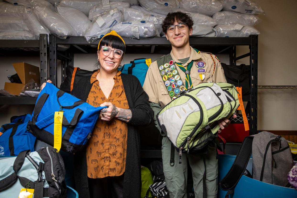 Carly Rice from the Rockford-based nonprofit Miss Carly's and Rockton Eagle Scout Damian Harms pose with "go bags" that Harms made for his Eagle Scout community service project on Wednesday, Jan. 25, 2023, in Rockford.