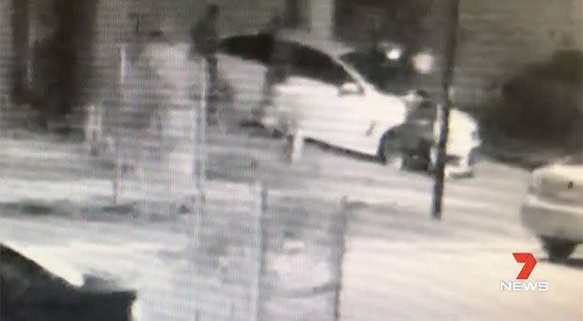 CCTV shows a hooded gang of seven swarming around the family’s car, at Rockbank, west of Melbourne, at 3.15 Sunday morning. Picture: Supplied