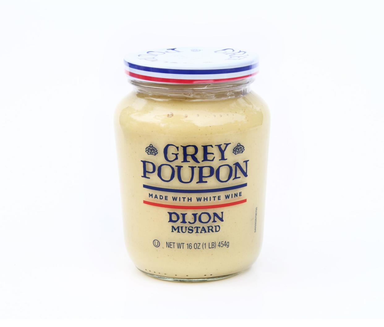 West Palm Beach, USA - December 25, 2014: A jar of Grey Poupon dijon mustard made with white wine. Grey Poupon is a product of Kraft Foods.