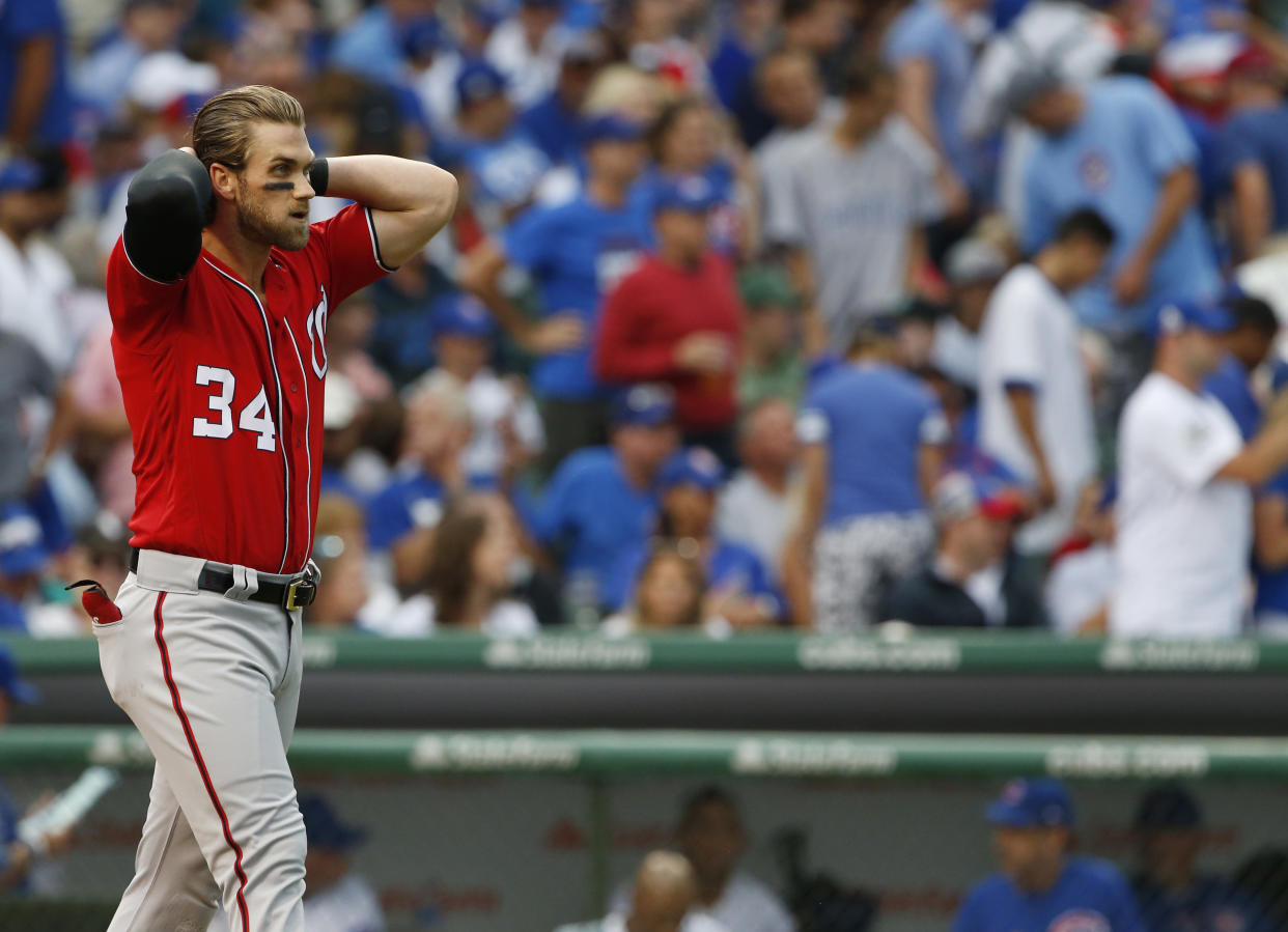 It doesn’t sound like Bryce Harper is signing with the Cubs. (AP Photo)
