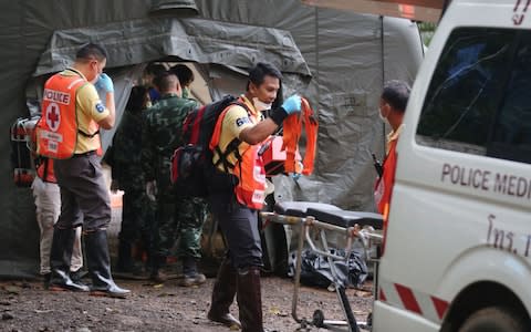 military and police personnel at the the quarantine tent in Tham Luang cave - Credit: AFP/Getty