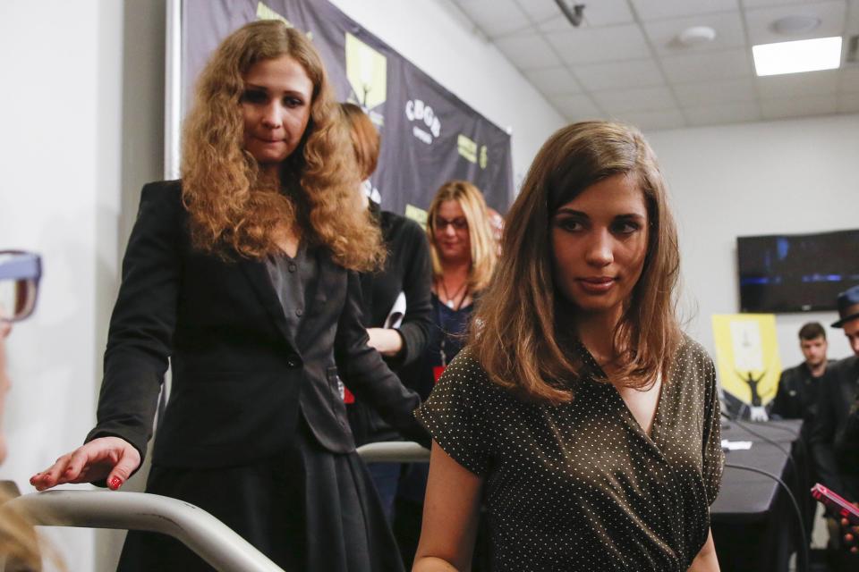 Pussy Riot members Tolokonnikova and Alyokhina leave a news conference before the Amnesty International Bringing Human Rights Home concert in New York