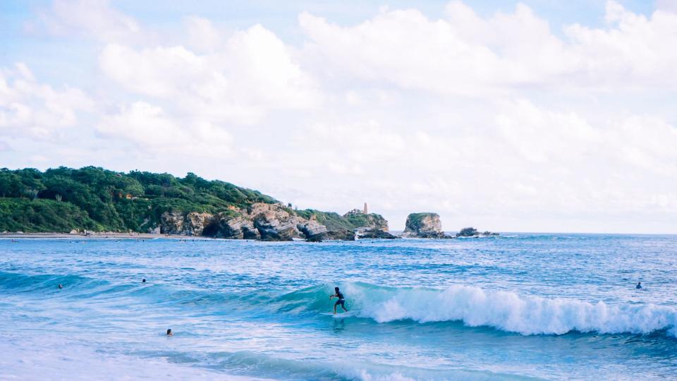 Surfers in the water at Puerto Escondido