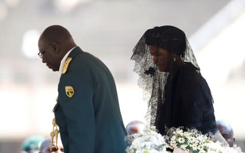 Grace Mugabe walks to pay her last respects to her late husband - Credit: SIPHIWE SIBEKO/Reuters