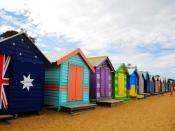 Brightly colored bathing boxes line the sand at Brighton Beach. Victorian morality created the huts, situated close to the shoreline so women could slip into their bathing costumes and race to the water discretely.