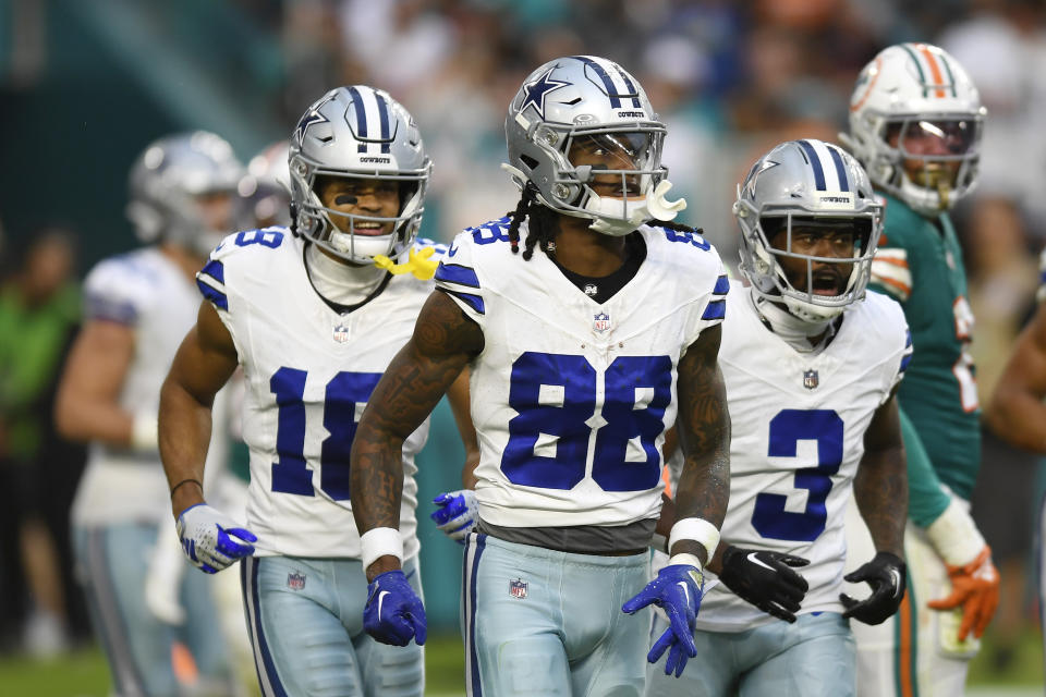 Dallas Cowboys wide receiver CeeDee Lamb (88) walks off the field after scoring a touchdown during the first half of an NFL football game against the Miami Dolphins, Sunday, Dec. 24, 2023, in Miami Gardens, Fla. (AP Photo/Michael Laughlin)