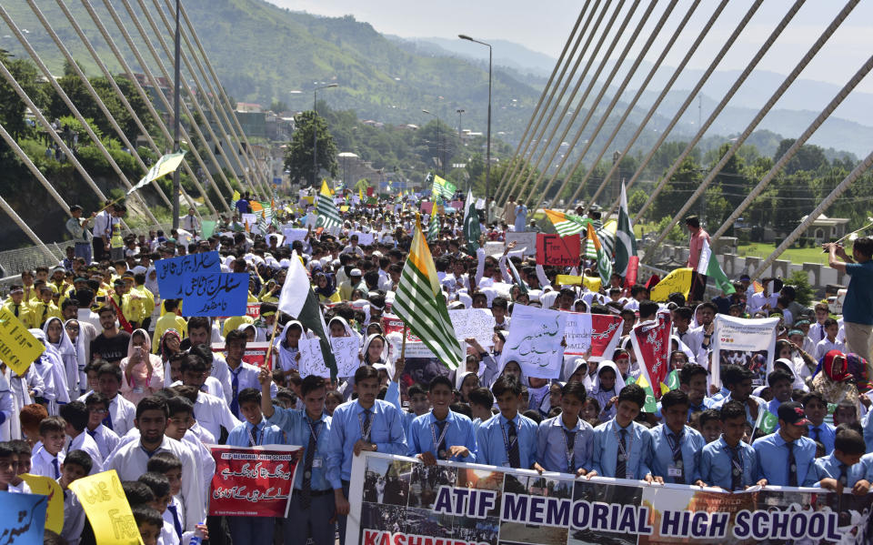 Pakistani students rally to express solidarity with Indian Kashmiris, in Muzaffarabad, capital of Pakistani Kashmir, Tuesday, Aug. 27, 2019. Students denounced India's downgrading of the special status of the portion of the disputed region it controls. (AP Photo/M.D. Mughal)