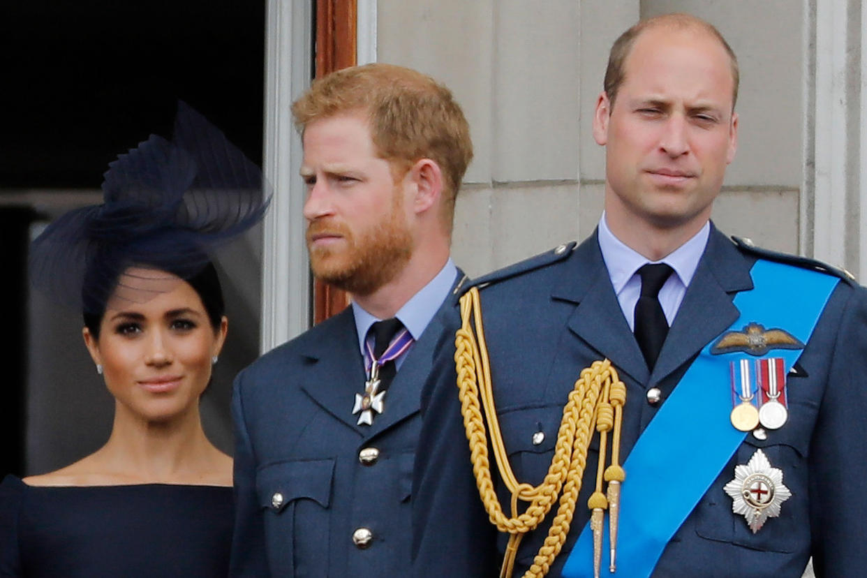 Image: Meghan, Prince Harry, and Prince William on the balcony of Buckingham Palace in 2018. (Tolga Akmen / AFP - Getty Images file)