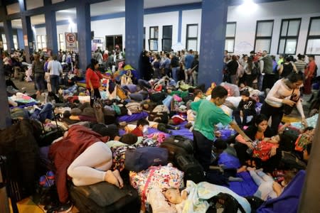 Venezuelan migrants wait at the Binational Border Service Center of Peru in Tumbes
