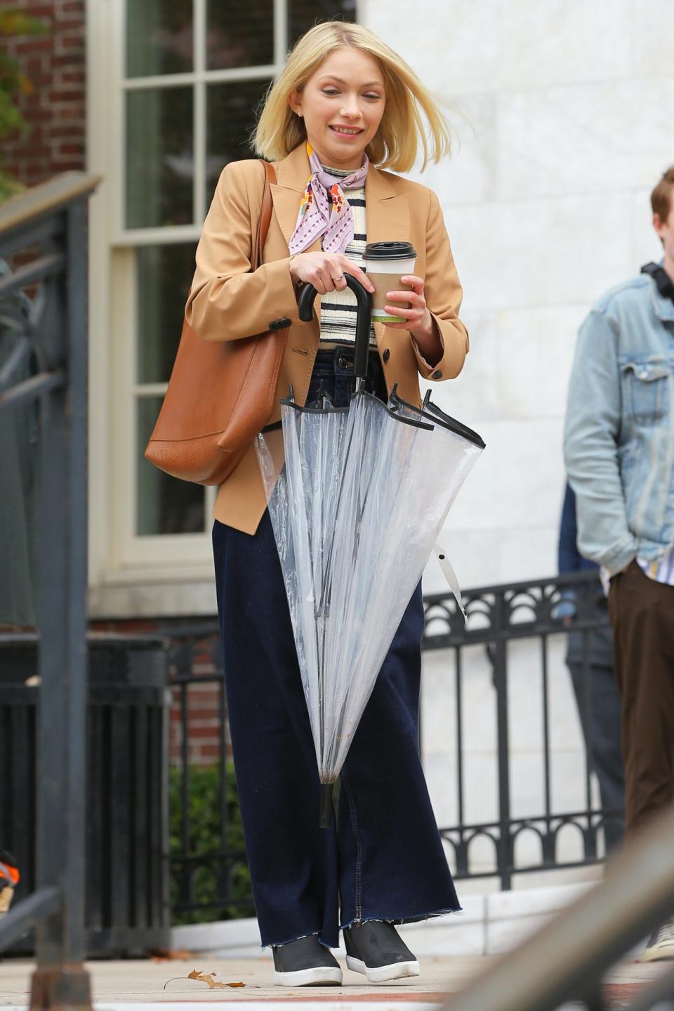 <p>Tevi Gevinson combats the cold weather by warming up with a drink as she films <em>Gossip Girl</em> at the Museum of the City of New York on Monday in N.Y.C.</p>