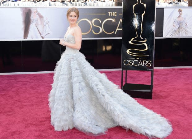<p>Nominated for Best Supporting Actress for <em>The Master</em>, Amy Adams elicited many "oohs" and "aahs" in this gray-blue Oscar de la Renta gown with a full tulle train, which she helped design.</p>