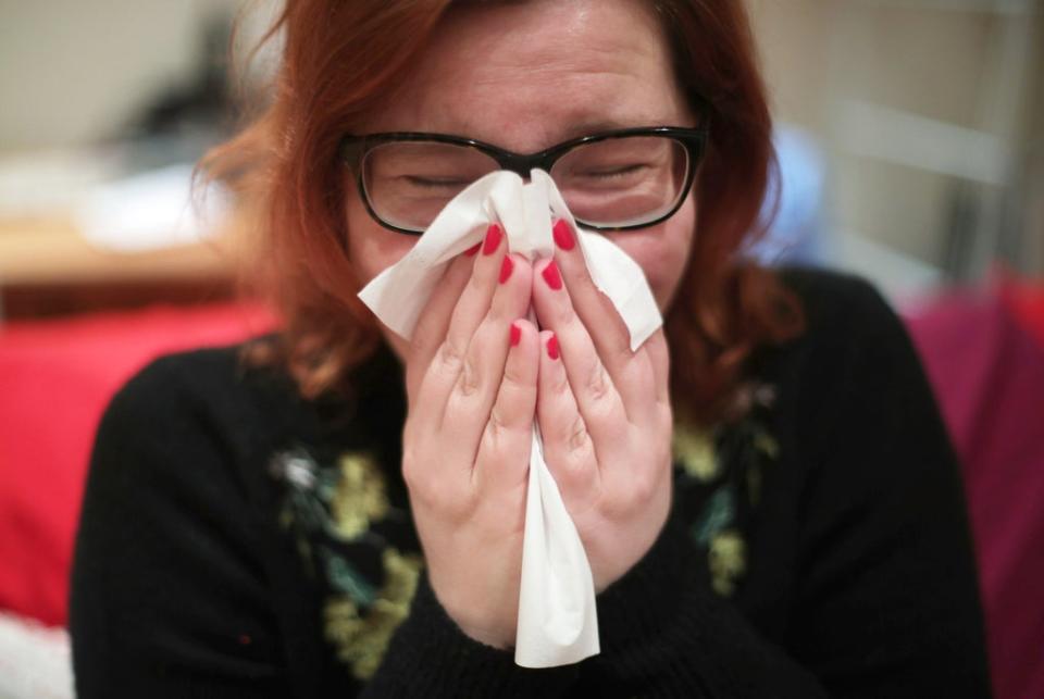 People are being urged not to grin and bear illness but stay away from the workplace if sick (Yui Mok/PA) (PA Archive)