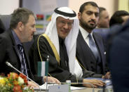 Prince Abdulaziz bin Salman Al-Saud, center, Minister of Energy of Saudi Arabia looks prior to the start of a meeting of the Organization of the Petroleum Exporting Countries, OPEC, at their headquarters in Vienna, Austria, Thursday, Dec. 5, 2019. (AP Photo/Ronald Zak)