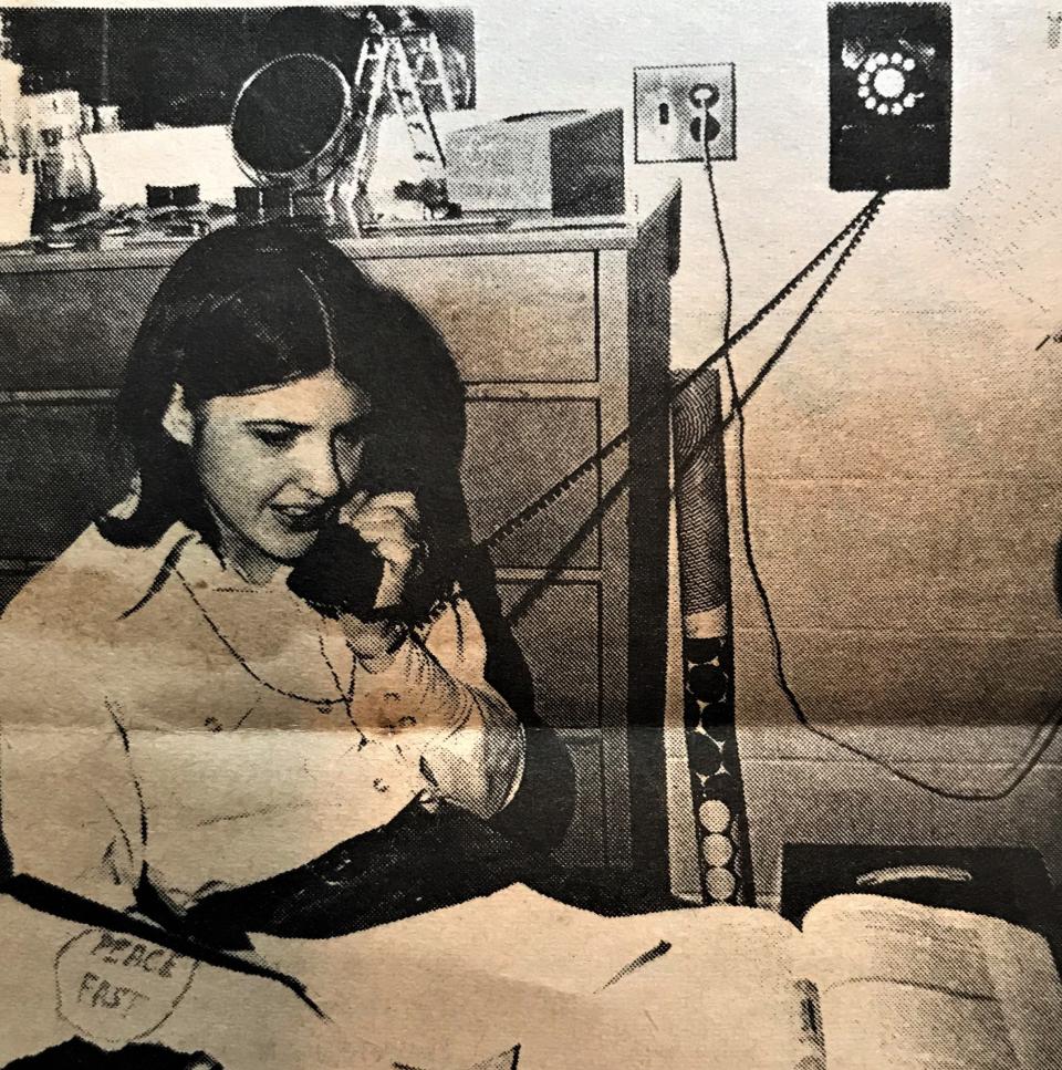 Mary (Munchel) Posner makes phone calls from her Ball State dorm room in 1969. Posner was a key figure in the Indiana antiwar movement during Vietnam.