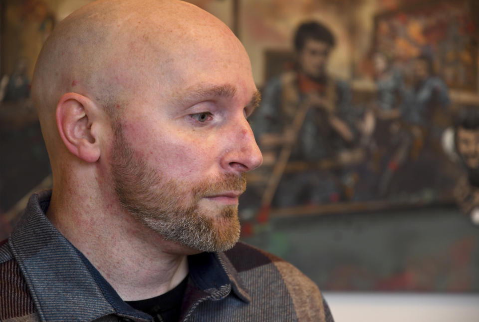 Scott Verti sits for an interview in downtown Denver on Wednesday, Jan. 18, 2023. Verti has filed a lawsuit alleging about 100 instances of abuse at St. Elizabeth Ann Seton Church in Fort Collins, Colo., from 1998 to 2003. The lawsuit is allowed under a 2021 state law that opened up a three-year window for people to pursue litigation for sexual abuse that happened to them as children dating as far back as 1960. (AP Photo/Thomas Peipert)