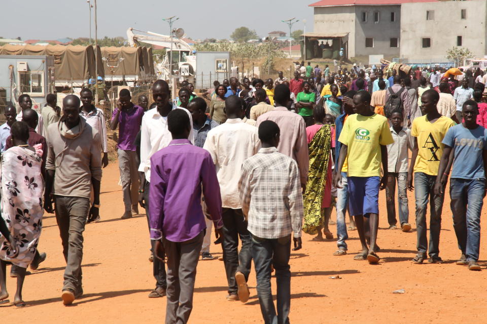 Picture taken on December 17, 2013 shows displaced people walking inside the UNMISS compound on the outskirts on Juba following recent fightings in the capital. (STR/AFP/Getty Images)
