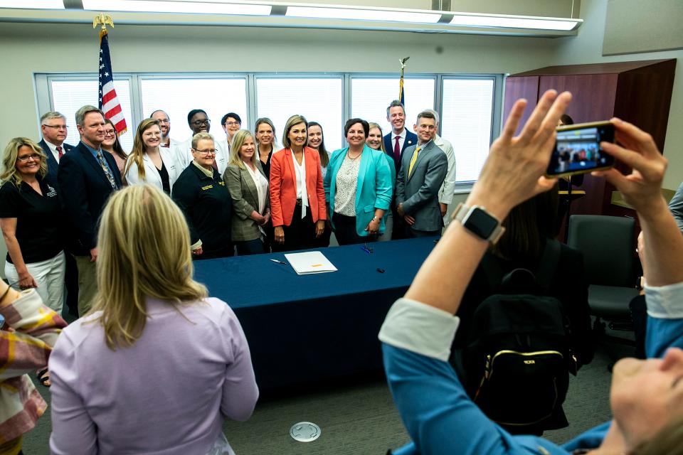 Gov. Kim Reynolds poses for a photo after a bill signing for House File 424, Wednesday, May 10, 2023, at the Washington County Hospital in Washington, Iowa.