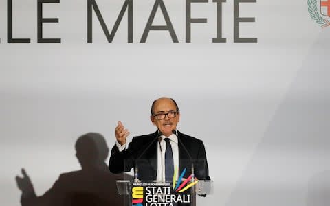 Italian anti-Mafia and counterterrorism prosecutor Federico Cafiero De Raho delivers his speech during a meeting in Milan, Italy - Credit: AP Photo/Antonio Calanni