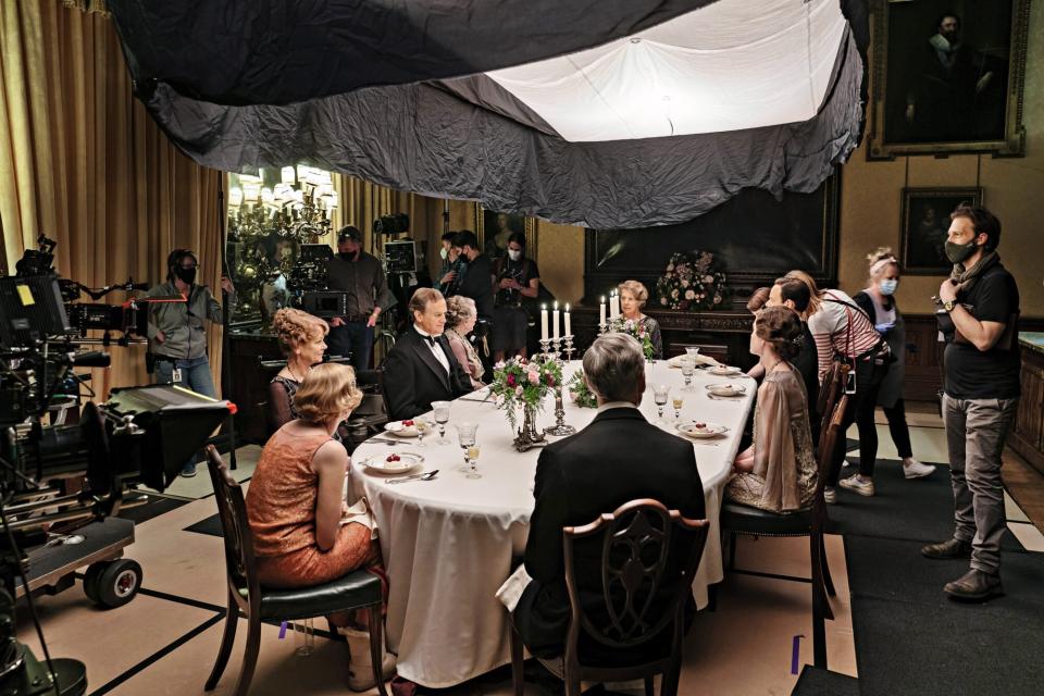 CREW members and actors Laura Carmichael, Samantha Bond, Hugh Bonneville, Maggie Smith, Penelope Wilton, Michelle Dockery, Harry Hadden-Paton, Elizabeth McGovern, Douglas Reith, along with 1st Asst. Director Adam Lock on the set of DOWNTON ABBEY: A New Era, a Focus Features release.