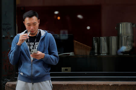 FILE PHOTO: A man smokes an e-cigarette in New York, U.S., September 27, 2018. REUTERS/Brendan McDermid/File Photo