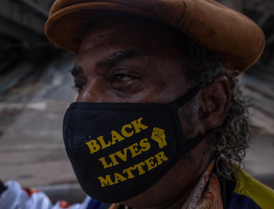 A resident of Tulsa, Oklahoma, sports a "Black Lives Matter" face mask during celebrations of Juneteenth in Greenwood, the site of the 1921 race massacre, on June 19, 2020.